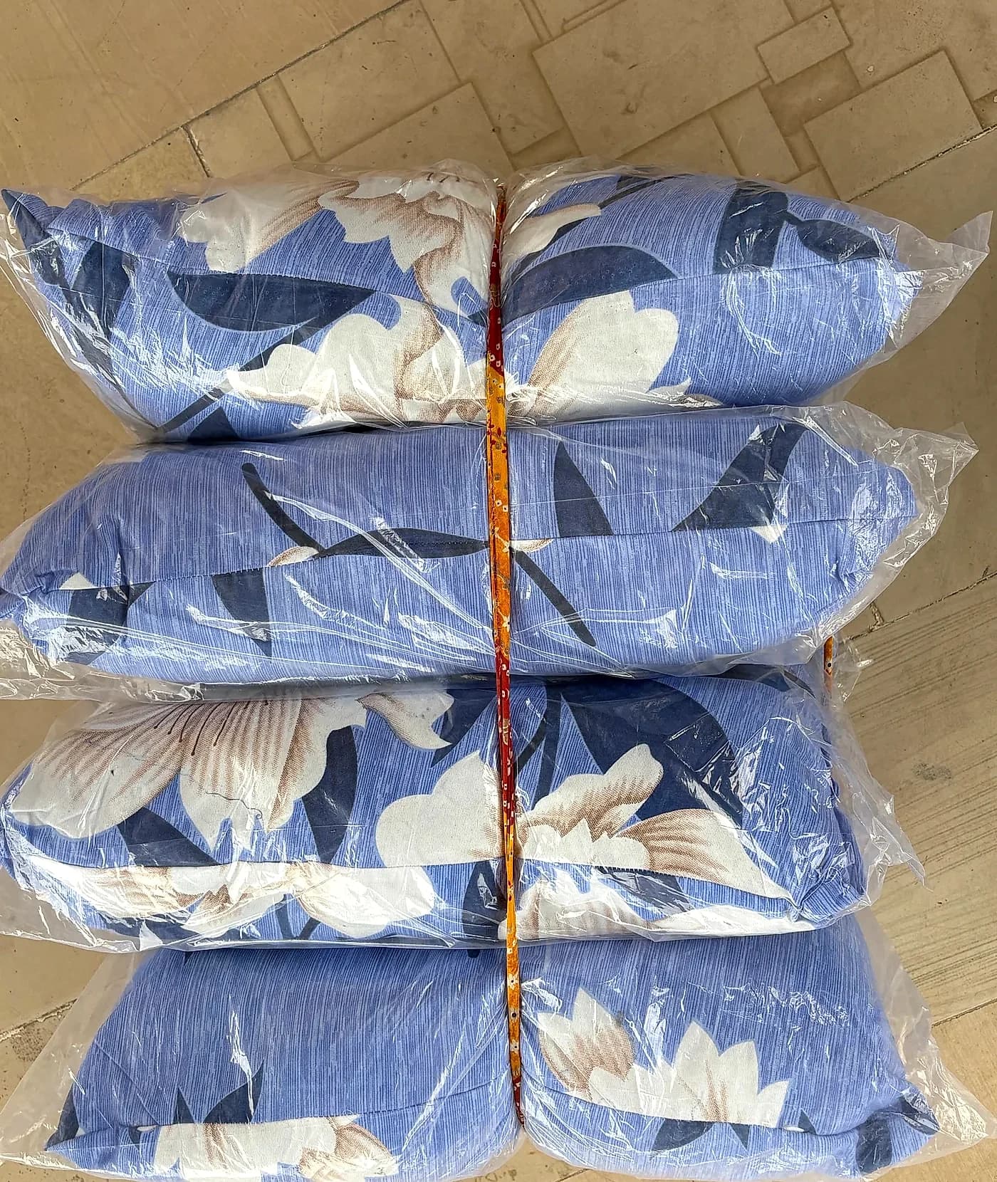Commercial strapped bundle of 4 pillows for wholesale dispatch