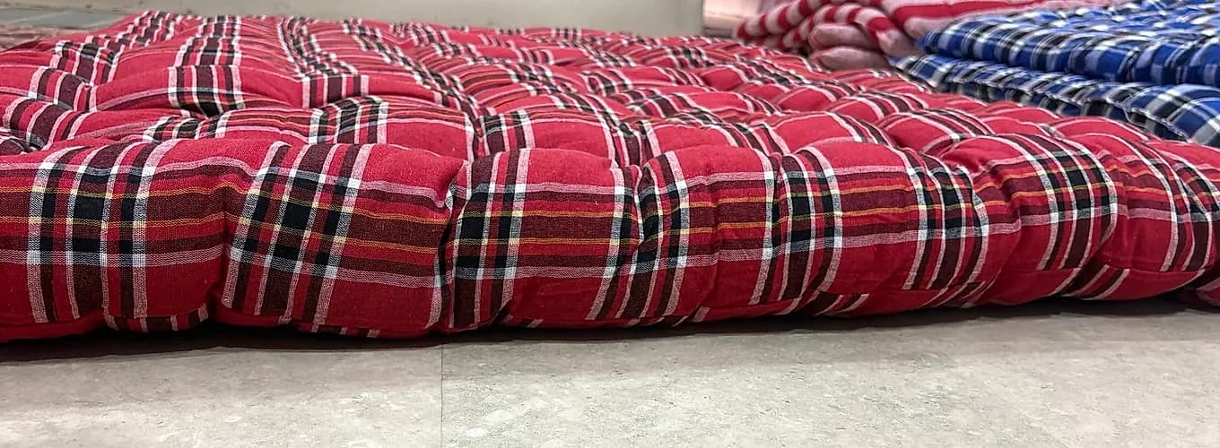 Traditional red and black plaid tartan tufted gadda profile